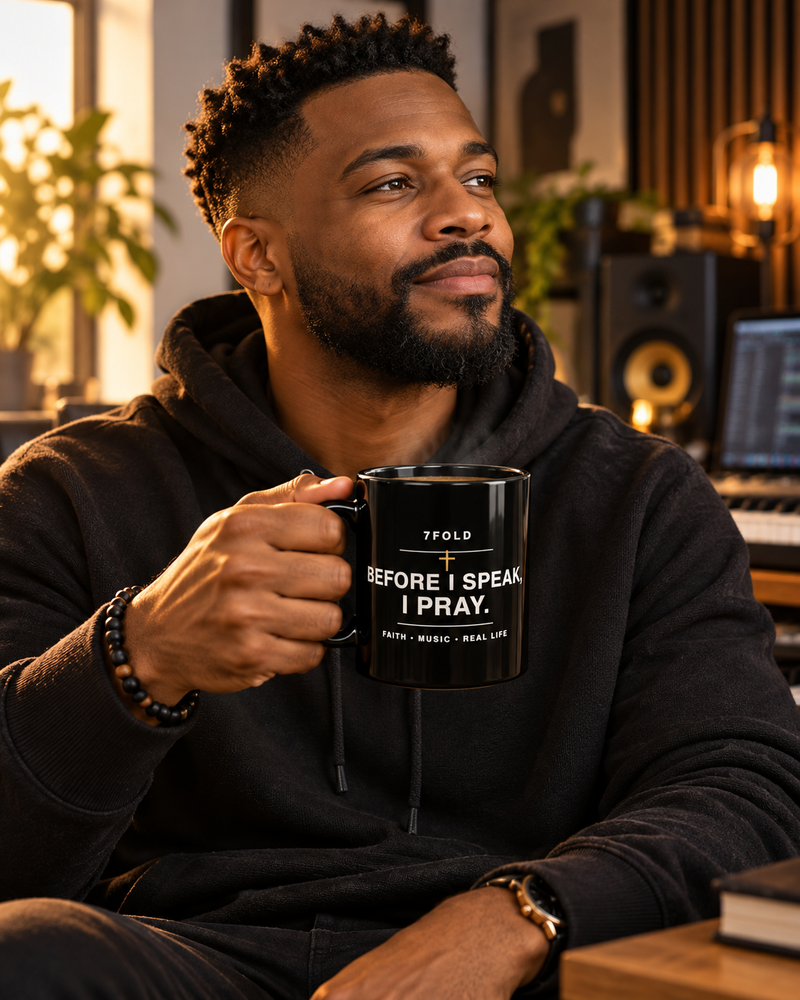 7Fold Before I Speak, I Pray mug held by a Black model